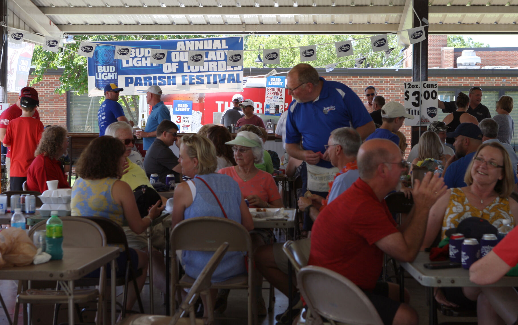 Festival goers congregate under a tent